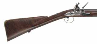 English Fowling Gun,
20 gauge, 38" octagon-to-round barrel,
Chambers flint lock, walnut, engraved brass,
used, by noted gun maker Michael Hayes