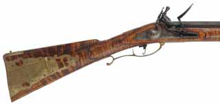 Early Virginia Longrifle,
.50 caliber, 44" barrel,
flint lock, curly maple, engraved brass trim,
near-new, by Ron Scott