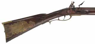 C. Beck, Pennsylvania Smoothrifle,
.54 caliber smoothbore, 47-1/2" octagon-to-round barrel,
flintlock, curly maple, brass with aged patina, 
attributed to Van Pittmann