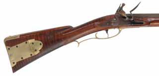 Colonial Longrifle,
.50 caliber, 43-1/2" swamped barrel, 
round faced flintlock, curly maple, polished brass
