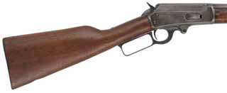 Marlin Model 1893 Lever Action Rifle,
caliber .38-55, 24" tapered round barrel, 
grade "B" for black powder cartridges, walnut, 
replaced buttplate, silver gray aged patina