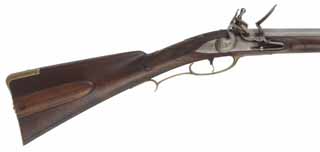 Colonial Longrifle,
.58 caliber, 43-1/2" Rice swamped barrel, 
Chambers flintlock, walnut, brass,
patina finish, signed by L. Cruise