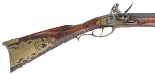 Ernst Longrifle,
.50 caliber, 44" swamped octagon barrel,
flint lock, curly maple, engraved brass trim, raised carving,
signed W. G. Shipman