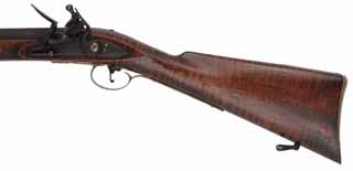 Left Hand Blunderbuss Coach Gun,
11 gauge, 14" octagon-to-round barrel with flared muzzle,
L&R Queen Anne flint lock, maple, brass trim with aged patina, 
used, unsigned