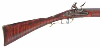 Bucks County Smooth Rifle,
20 gauge 42" Rice octagon-to-round barrel,
Chamber's flintlock, curly maple, brass trim, by Brian Staley