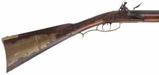 Lancaster County, Pennsylvania Longrifle,
.50 caliber 42" straight octagon barrel,
brass trim with daisy patchbox, small Siler flintlock, curly maple stock,
signed by G. Suiter, Williamsburg, Va