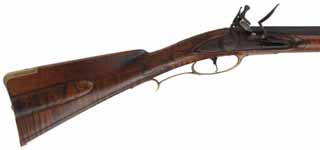 Colonial Longrifle,
.54 caliber, 43-1/2" swamped barrel, 
round faced flintlock, curly maple, engraved brass,
light patina finish, signed by Mike Compton