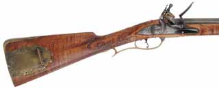 Early Colonial Longrifle,
.58 caliber, 42" swamped Rice barrel,
flintlock, curly maple, engraved brass trim,
new, unfired, by Robert Faddis