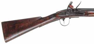 North West Trade Gun,
.54 caliber rifled, 41-1/2" octagon-to-round barrel,
additional 20 gauge smoothbore barrel, maple, brass and iron,
used, by Danny Caywood