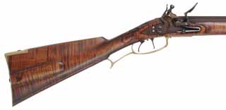 Isaac Haines Longrifle, 
.54 caliber, 38" Colerain swamped barrel,
Siler flintlock, curly maple, brass trim, 
used, by John Bergmann