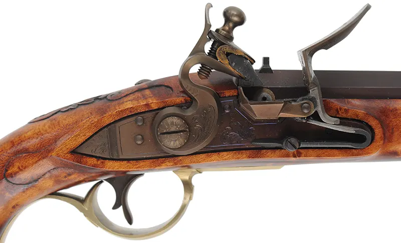Kentucky Pistol
.50 caliber 10-1/2" tapered barrel,
small Siler flint lock, curly maple,
engraved brass trim, signed by R.W. Deitz Kentucky Pistol
.50 caliber 10-1/2" tapered barrel,
small Siler flint lock, curly maple,
engraved brass trim, signed by R.W. Deitz