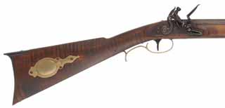 H.E. Leman Trade Rifle,
.45 caliber, 32-1/2" Colerain barrel,
Buckridge flintlock, iron & brass, curly maple, 
used, by Ted Kramer