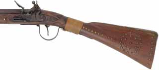 Left Hand Trade Gun,
12 gauge, 36" octagon-to-round barrel,
flintlock, walnut, brass and iron, tacks, used