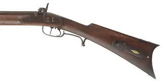 Left Hand Tennessee Mountain Rifle,
.40 caliber, 46"  Rayl straight octagon barrel,
Siler percussion lock, walnut, iron trim,
used, marked C.D. Walker