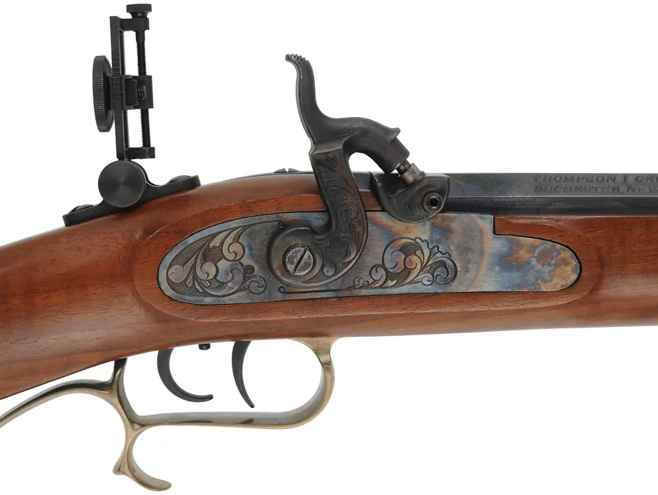 Thompson Center Hawken Rifle, 
.50 caliber, 28" barrel, 
percussion, figured walnut, brass trim, 
Vernier and globe sights, Lyman mold & handles, accessories,
used, by Thompson Center Arms