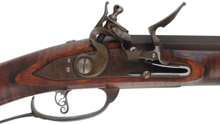 Lancaster Longrifle,
.40 caliber, 38" Getz swamped barrel,
Siler flintlock, curly maple, iron,
used, by J. Goodoien Lancaster Longrifle,
.40 caliber, 38" Getz swamped barrel,
Siler flintlock, curly maple, iron,
used, by J. Goodoien