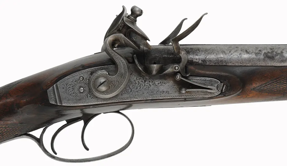 Antique Double Shotgun,
24 gauge, 36" Damascus barrels,
walnut, iron trim, flintlocks marked E & W Bond Antique Double Shotgun,
24 gauge, 36" Damascus barrels,
walnut, iron trim, flintlocks marked E & W Bond