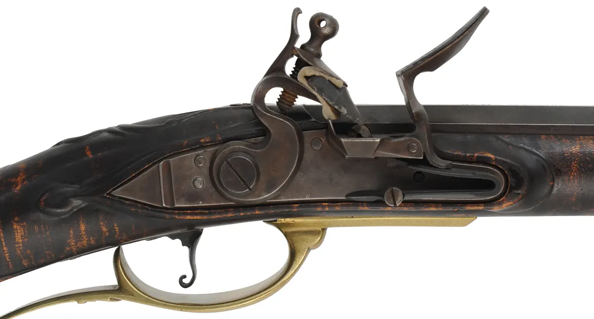 Pennsylvania Longrifle, 
.45 caliber, 44" G.R. Douglas straight octagon barrel,
large Siler flintlock, curly maple, brass,
used, signed R. Grieder