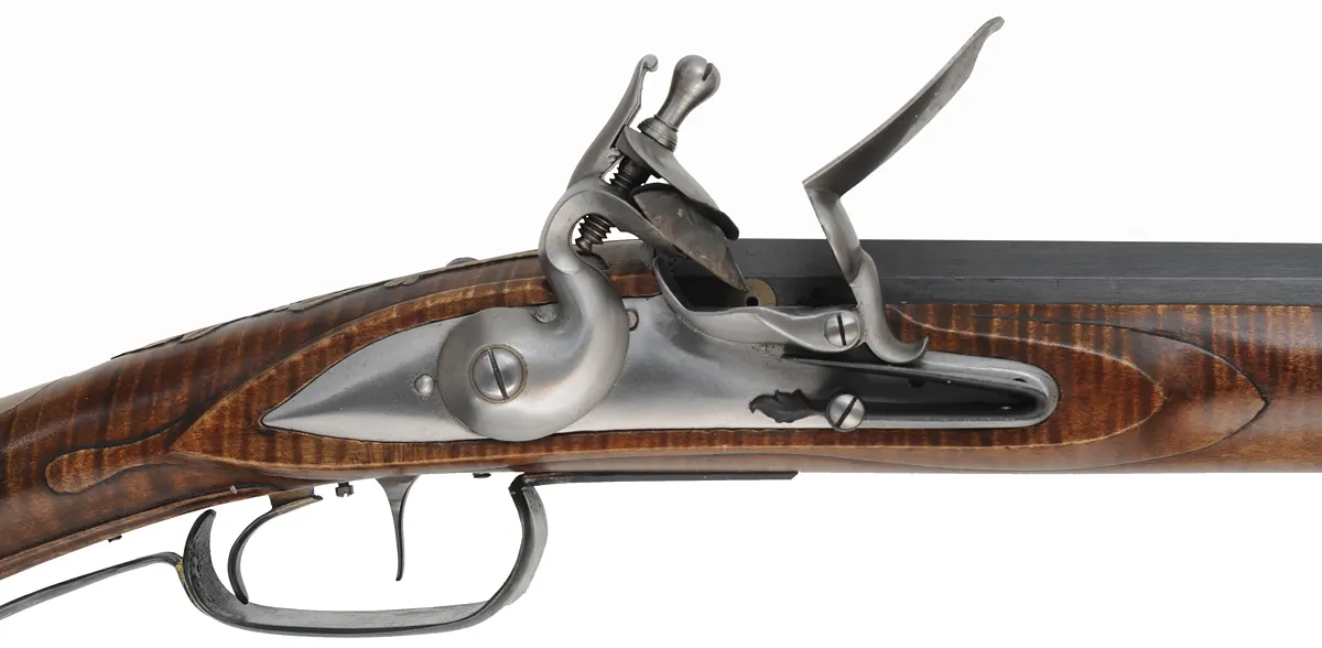 Virginia Longrifle
.54 caliber, 44" swamped barrel,
curly maple, hand forged iron trim with silver accents,
Chambers' lock, used, signed by David Kuyper