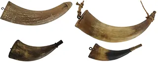 Group of Four Antique Powder Horns
in various condition, sold as is