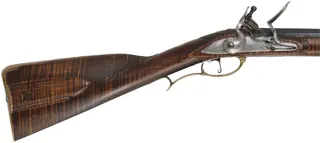 J. Faber, Virginia Longrifle,
.58 caliber, 43-1/2" swamped octagon barrel,
curly maple, brass furniture, sliding wooden patchbox, 
used, signed by Michael Hayes