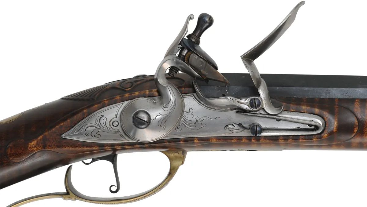 J. Faber, Virginia Longrifle,
.58 caliber, 43-1/2" swamped octagon barrel,
curly maple, brass furniture, sliding wooden patchbox, 
used, signed by Michael Hayes