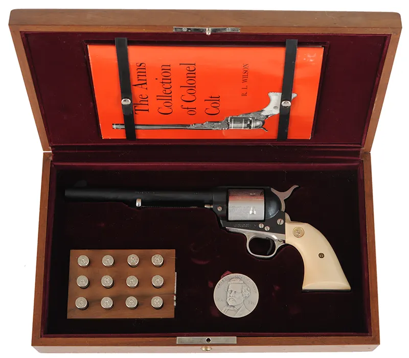 Colt Sesquicentennial Model 1873 Single Action Army Revolver,
.45 Colt, 7-1/2" barrel,
blued, engraved, fitted wood display case,
by Colt Firearms Mfg. Co. Colt Sesquicentennial Model 1873 Single Action Army Revolver,
.45 Colt, 7-1/2" barrel,
blued, engraved, fitted wood display case,
by Colt Firearms Mfg. Co.