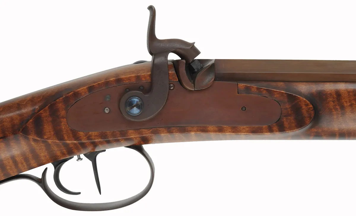 Hawken Rifle,
.54 caliber 36" Green Mountain barrel,
L&R percussion lock, iron, curly maple,
used, signed by George Nelson