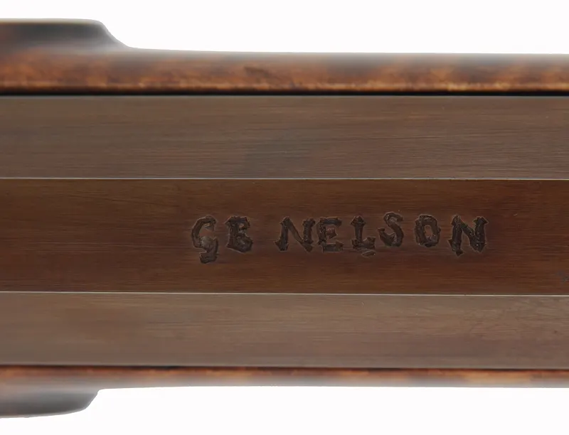 Hawken Rifle,
.54 caliber 36" Green Mountain barrel,
L&R percussion lock, iron, curly maple,
used, signed by George Nelson