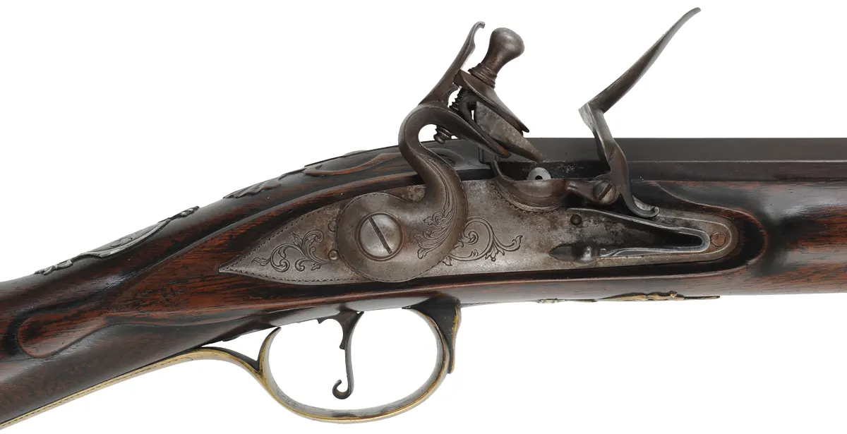 Southern Longrifle,
.50 caliber coned muzzle, 42" swamped barrel,
flintlock, curly maple, engraved brass trim,
used, by Robert Harn Southern Longrifle,
.50 caliber coned muzzle, 42" swamped barrel,
flintlock, curly maple, engraved brass trim,
used, by Robert Harn