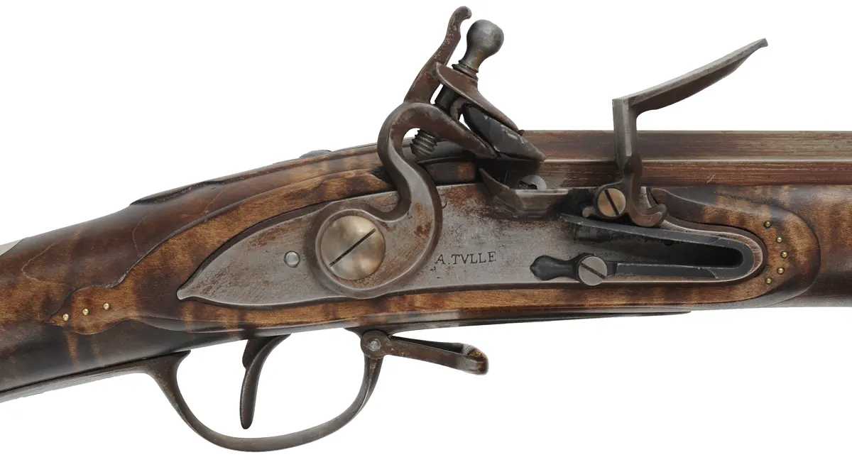 French Tulle fusil-de-chasse,
20 gauge, 44" octagon-to-round barrel, 
TVLLE marked flintlock, maple, patina finished iron trim,
cross and brass tacks, sling, used