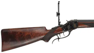 1885 Winchester High Wall Rifle,
caliber .40-65 Ron Long, 29-1/2" Ron Long barrel, 
figured walnut, iron, double set triggers,
used, attributed to Ron Long, includes die set