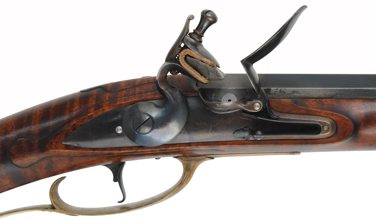 Colonial Longrifle,
.50 caliber,  43-1/2" swamped barrel, 
round faced flintlock, curly maple, brass, used
