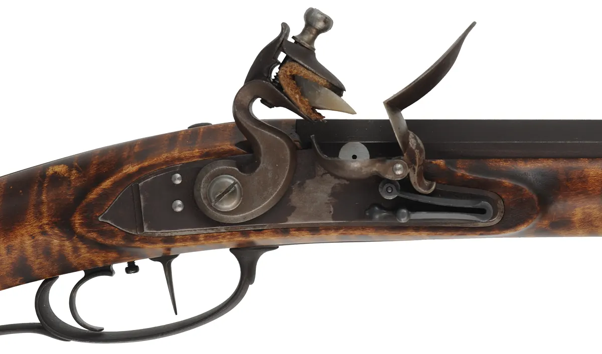 Southern Mountain Rifle,
.40 caliber,  46" Rice swamped barrel,
Ketland flintlock, curly maple, iron trim, used