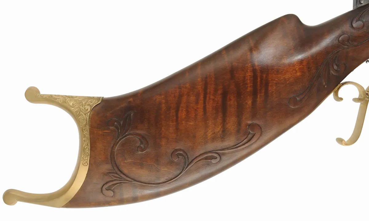 Schuetzen Offhand Target Rifle,
.40 caliber, 31" Oregon Rifle Works barrel,
walnut, brass furniture, globe & tang sight,
palm rest, engraved, by B. Raby