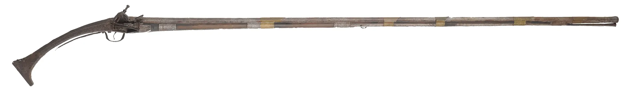 Antique Miquelet Musket, 
.60 caliber smoothbore, 54-1/2" barrel,
Miquelet flintlock, engraved steel & brass trim