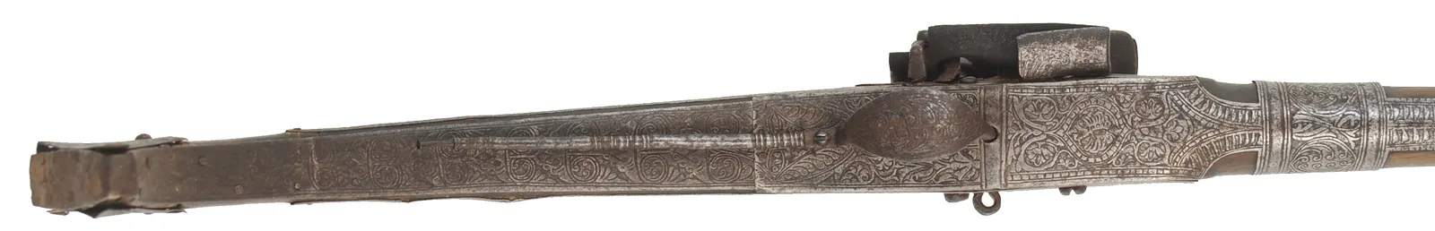 Antique Miquelet Musket, 
.60 caliber smoothbore, 54-1/2" barrel,
Miquelet flintlock, engraved steel & brass trim