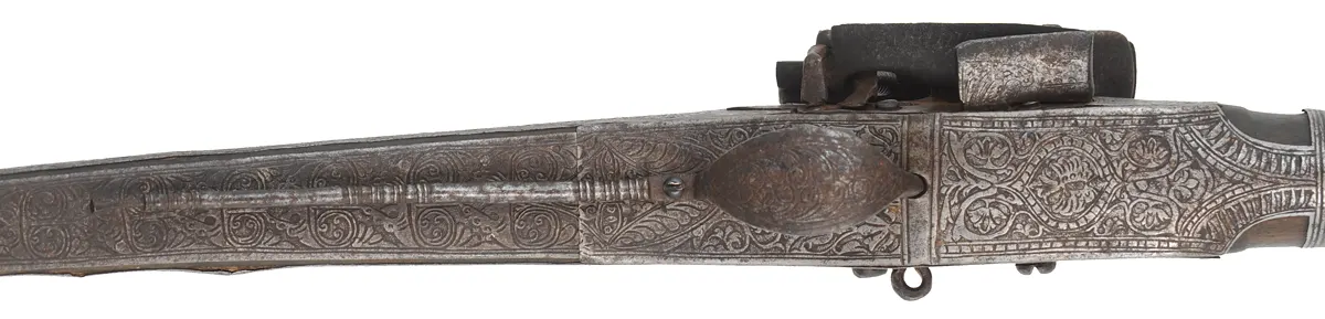 Antique Miquelet Musket, 
.60 caliber smoothbore, 54-1/2" barrel,
Miquelet flintlock, engraved steel & brass trim