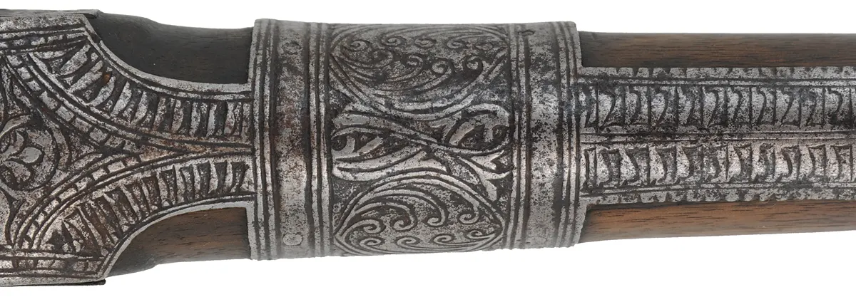 Antique Miquelet Musket, 
.60 caliber smoothbore, 54-1/2" barrel,
Miquelet flintlock, engraved steel & brass trim