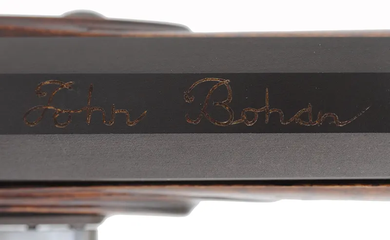 Virginia Longrifle,
.50 caliber, 38" Rice swamped barrel, 
Chambers flintlock, curly maple, engraved brass,
signed by J. Bohan