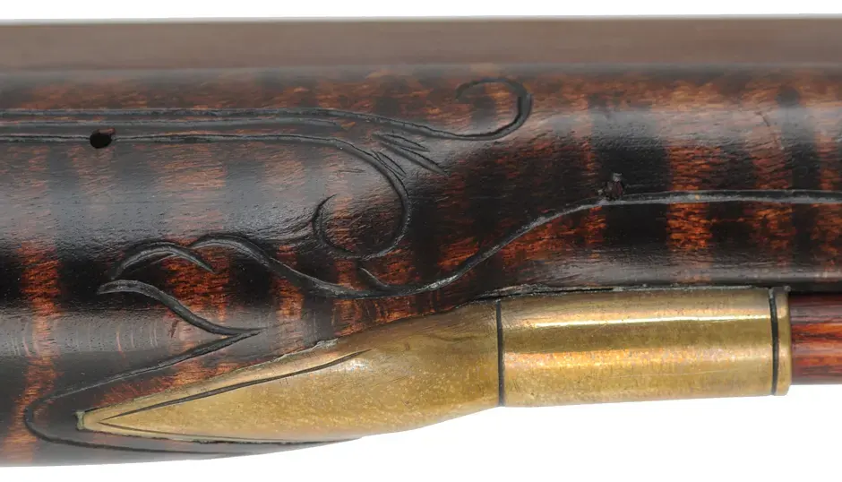 Kentucky Pistol,
.50 caliber 9-1/4" barrel,
small Siler flintlock, engraved brass, curly maple, 
used, by J. Kirklin