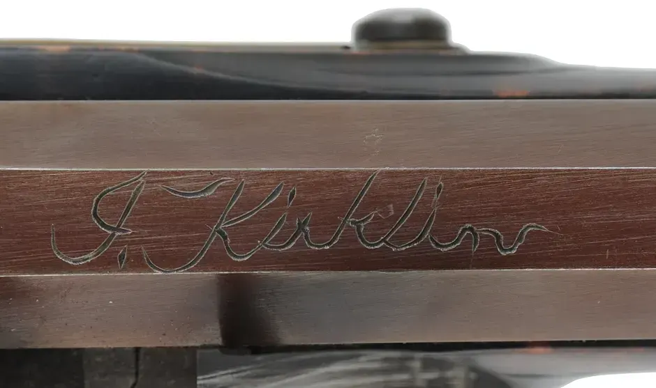 Kentucky Pistol,
.50 caliber 9-1/4" barrel,
small Siler flintlock, engraved brass, curly maple, 
used, by J. Kirklin