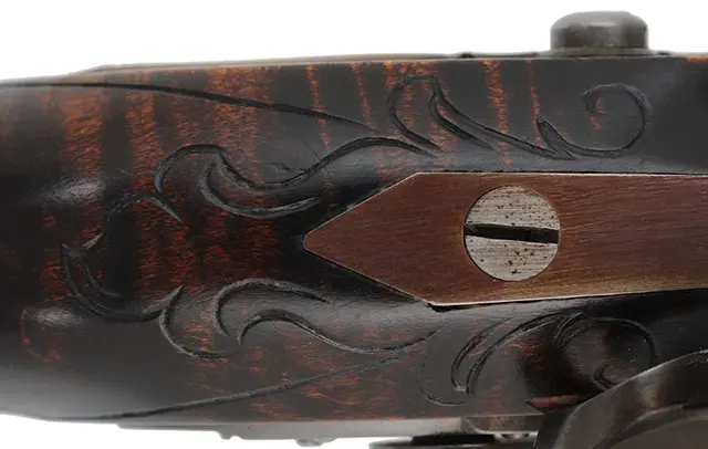 Kentucky Pistol,
.50 caliber 9-1/4" barrel,
small Siler flintlock, engraved brass, curly maple, 
used, by J. Kirklin