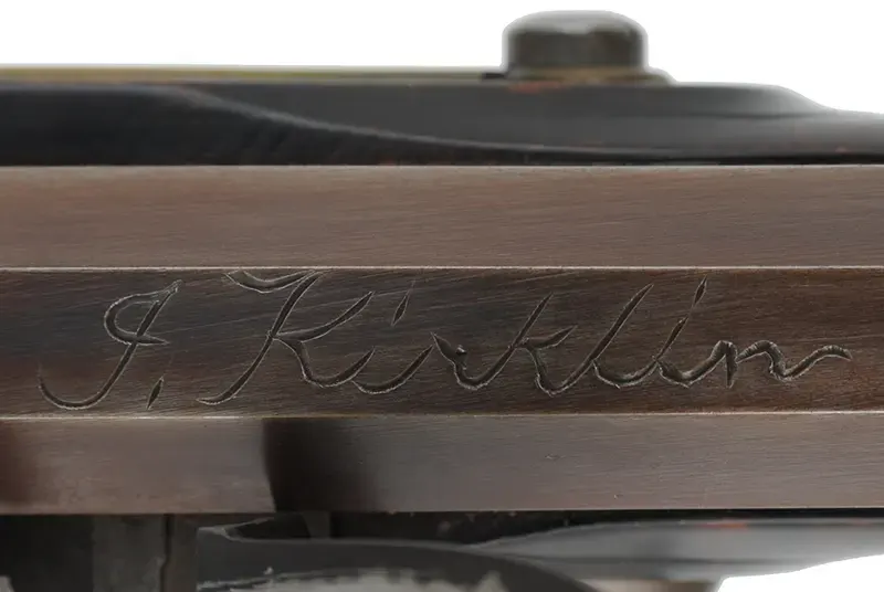 Kentucky Pistol,
.50 caliber 9-1/4" barrel,
small Siler flintlock, engraved brass, curly maple, 
used, by J. Kirklin