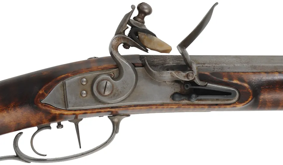 Southern Mountain Rifle,
.45 caliber,  46" Rice swamped barrel,
Chambers Ketland flintlock, curly maple, iron, used