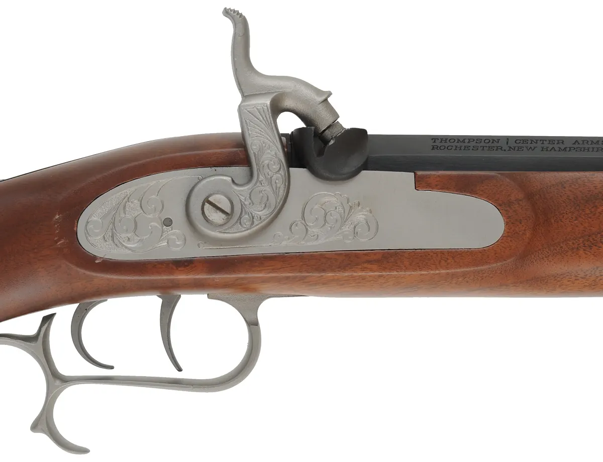 Thompson Center Hawken Cougar Rifle,
.50 caliber, 28" barrel,
percussion, fancy walnut stock, stainless steel trim,
used, by Thompson Center Arms