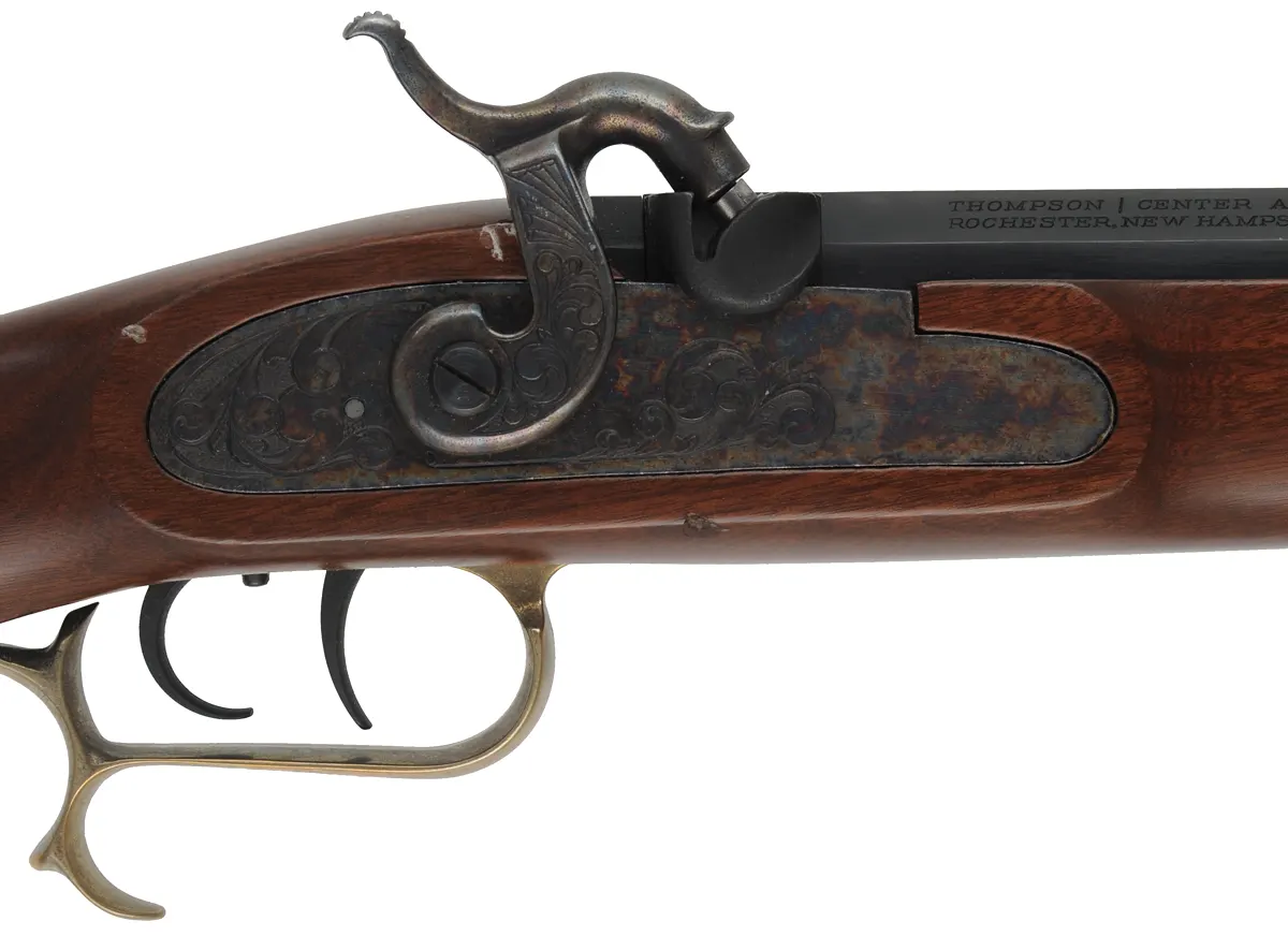 T/C Hawken Rifle,
.54 caliber, 28" barrel,
percussion, walnut stock, brass trim, 
used, by Thompson Center Arms