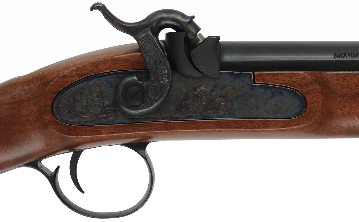 T/C New Englander Rifle,
.50 caliber with QLA, 26" barrel,
percussion, figured walnut, iron trim, 
appears unfired, by Thompson Center Arms