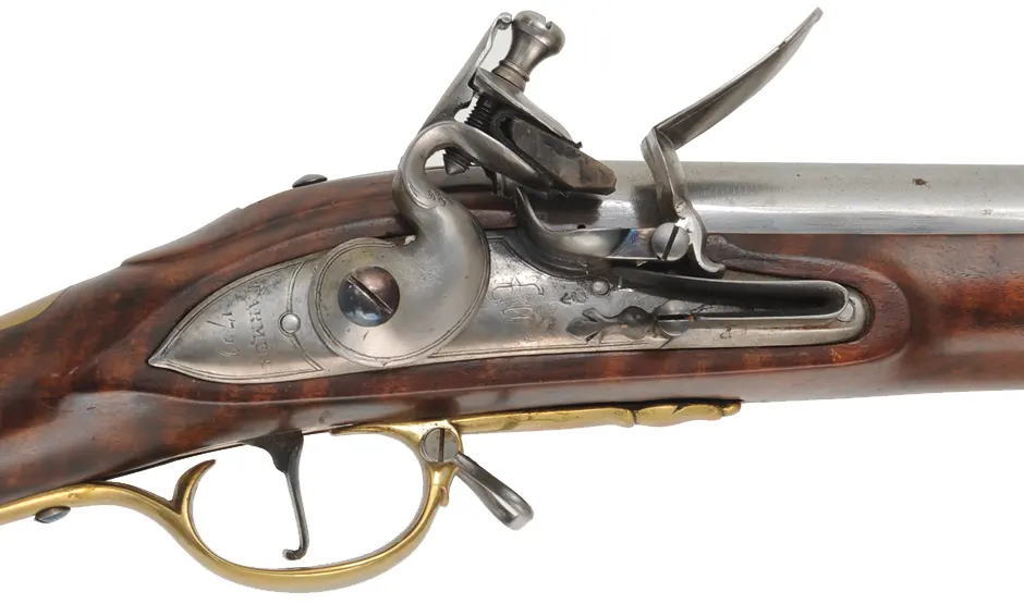 1756 British Artillery Carbine,
.62 caliber smoothbore, 37" barrel, 
flint lock, figured Claro walnut, bras trim, used