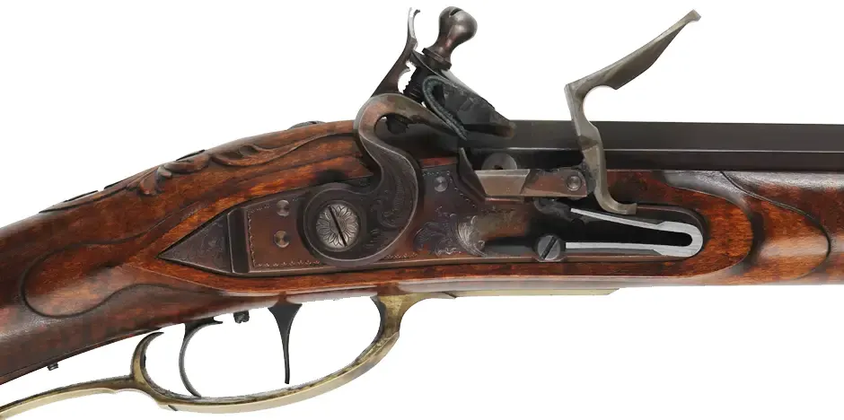 Fine Lancaster County, Pennsylvania Longrifle,
.40 caliber, 42" Green Mountain swamped barrel, 
large Siler flintlock, curly maple, brass trim,
raised carving, engraved patchbox, signed by contemporary builder R. Dietz